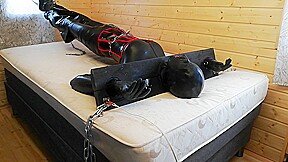Latex Rubber fetish crossdresser pillory